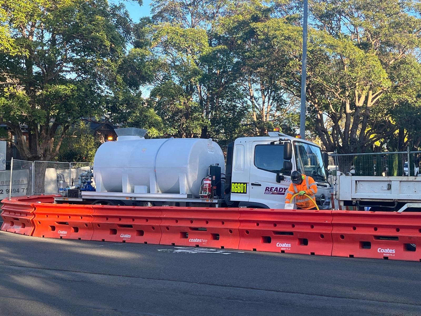Ready Group water cart and operator on a Sydney street works site